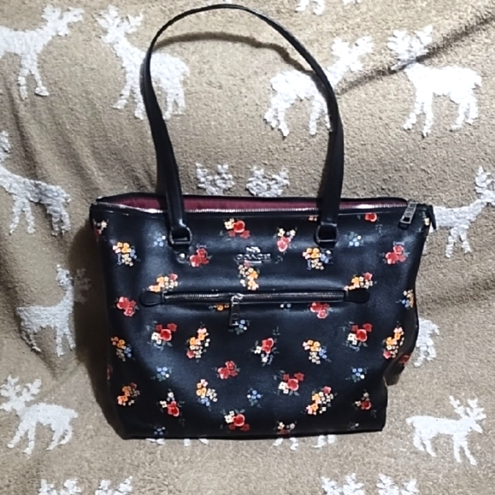 Elegant Coach Black Floral Tote Bag. measures 11*15*5